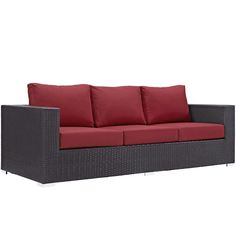 an outdoor sofa with red cushions and pillows on the back, in front of a white background