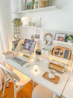 a white desk topped with a laptop computer