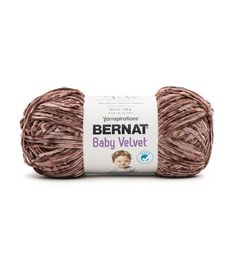 bernat baby velvet yarn ball in light brown, on a white background with the label