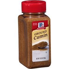 ground cumin in a jar on a white background