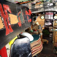 a room filled with lots of different types of skateboards and other things in it