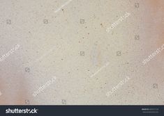 the texture of an old white wall with brown spots on it, as well as some other