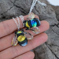 Unique dichroic glass bee necklace is a great gift for mom sister or grandma. Honey bee pendant is an absolutelly handmade jewelry made frm silver glass.  Details material: glass, dichroic glass, silver glass, metal chain width 3 cm - 1.18 inch height of the bee: 2.5 cm - 1 inch chain length: 44 cm - 17 inch (can be +-1-2 cm) Here you can find bee earrings https://www.etsy.com/listing/857932674/dangle-bee-earrings-for-women-bee?ref=shop_home_active_1 Diy Jewelry Making Tutorials, Lampwork Jewelry, Lampwork Earring, Bee Pendant, Bee Necklace, Bee Earrings, Kids Necklace, Great Gifts For Mom, Silver Glass