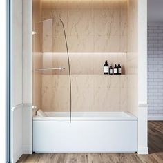 a bathroom with a bathtub and shelves on the wall, along with two bottles