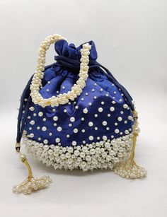 "luxury satin silk pearl embellish drawstring wedding party evening bag for woman | decorative handmade fabric handbag with beaded chain Size: 10\" x 8\" Designed with the heart, this beautiful Potli or batawa bag are eye catchy and made of premium material. Key Features: Art work. This potli is good match with both Indian and western outfits and are superb for wedding and festive parties. This would be best complement to your designer saree, lenhga or any other kind of dress. This is the combin Potli Bags Wedding, Art Deco Wedding Favors, Fancy Face Mask, Everyday Handbag, Fabric Handbags, Potli Bags, Art Deco Wedding, Handmade Fabric, Designer Saree