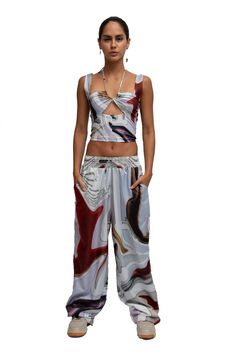 Printed baggy pants. Water-resistant. Oversized fit. Casual Printed Harem Pants For Summer, Printed Summer Loungewear Pants, Spring Abstract Print Wide Leg Bottoms, Chic Abstract Print Pants For Spring, Wide Leg Bottoms With Abstract Print For Summer, Summer Wide Leg Bottoms With Abstract Print, Chic Baggy Parachute Pants For Summer, Trendy Summer Wide-leg Harem Pants, Casual Wide Leg Pants With Abstract Print