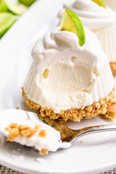 two desserts on a plate with whipped cream and lime