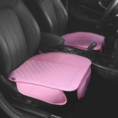 two pink seats in the back of a car