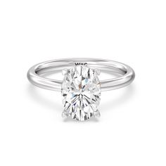 a round cut diamond engagement ring on a white background