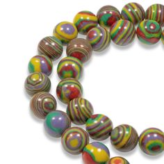 multicolored glass beads are arranged in a circle