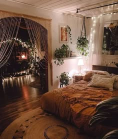 a bed room with a neatly made bed and lots of plants