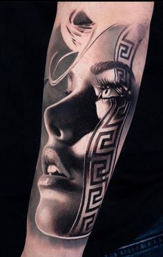 a woman's face is shown on the arm with an artistic pattern in black and white