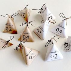 the numbers are numbered in different shapes and sizes as well as tied with twine