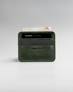 "The credit holder is made of genuine leather. The combination of materials creates a beautiful card case that will last for years and is a pleasure to touch every day. DESIGN: Available in five colors: Gray Ginger Brown Green Black MEASUREMENT: 3.1\" x 4.3\" (8.7cm x 11cm) HOW IS IT DONE? 100% handmade from selected leather." Green Bifold Everyday Card Holder, Everyday Green Bifold Card Holder, Green Rfid Blocking Card Holder Gift, Green Handmade Card Holder For Everyday Use, Green Wallets With Card Slots As A Gift, Green Wallets With Card Slots For Gift, Green Rectangular Card Holder For Daily Use, Minimalist Rectangular Card Holder With Slots, Green Rectangular Card Holder For Personal Use