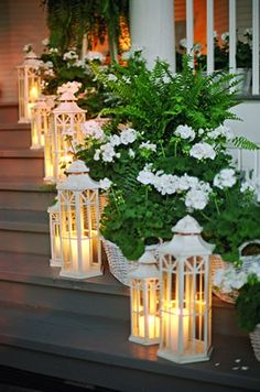 some white lanterns are sitting on the steps