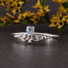 "Womens blue topaz silver ring, Unique small & dainty art deco topaz promise ring for her, Delicate filigree silver promise ring WE OFFER UNLIMITED PERIOD INSTALLMENTS PLAN This is a beautiful, stunning, feminine ring that works well for all occasions, styles, and ages. You will love it! Ring information Main stone: Sky topaz Approximate size: 3.0mm Accent stones: White cubic zirconia Approximate size: 1.5mm (2 stones) Approximate size: 1.25mm (2 stones) Metal type: Silver Metal stamp: 925 S Elegant Light Blue Diamond Ring, Dainty Topaz Promise Ring With Diamond Accents, Dainty Diamond Topaz Promise Ring, Dainty Sapphire Ring With Center Stone, Dainty White Gold Topaz Ring For Anniversary, Elegant Light Blue Rings With Prong Setting, Elegant Light Blue Topaz Ring With Prong Setting, Dainty Sterling Silver Diamond Ring With Rose Cut, Dainty Sterling Silver Ring With Rose Cut Diamonds