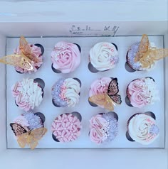 the cupcakes are decorated with pink and white frosting, butterflies on them