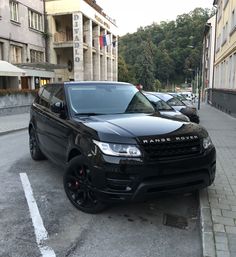 a range rover parked on the side of a street