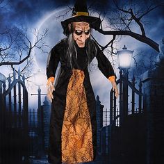 a halloween scene with an old man dressed as a witch