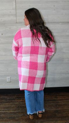 A pink long cardigan with a checkered design on it. This will keep you warm in the up-coming fall/ winter season. Fit: true to size Small: 2-4 Medium: 6-8 Large: 10-12 Model: medium Laundry: wash on cold, hang to dry Pink Sweater For Fall Cold Weather, Pink Sweater For Cold Weather In Fall, Cozy Plaid Sweater For Spring, Pink Casual Cardigan For Cold Weather, Casual Pink Cardigan For Cold Weather, Cozy Pink Cardigan For Cold Weather, Pink Cardigan For Cold Weather In Spring, Cozy Pink Sweater Coat For Fall, Fall Gingham Outerwear With Long Sleeves