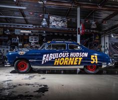 an old blue car with the name fabulous hudson hornet painted on it's side