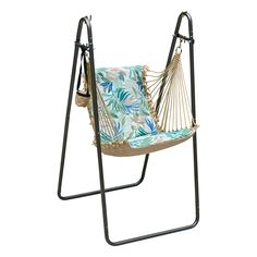 a hammock chair with blue and green leaves on it