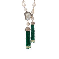 The Nangai Necklace epitomizes elegance and uniqueness with its off-white gold-dipped finish and asymmetrical mother of pearl pendant. Enhanced by two jade tassels, the design creates a striking contrast, adding sophistication and flair to your wardrobe. Luxury Long Pearl Charm Necklace, Luxury Long Necklace With Pearl Charm, Luxury Long Pearl Pendant Necklace, Luxury Long Necklace With Pearl Pendant, Luxury Gemstone Drop Necklace, Elegant Long Drop Tassel Jewelry, Elegant Long Pearl Necklace With Natural Stones, Elegant Festive Necklace With Detachable Pendant, Elegant Necklace With Detachable Pendant For Festive Occasions