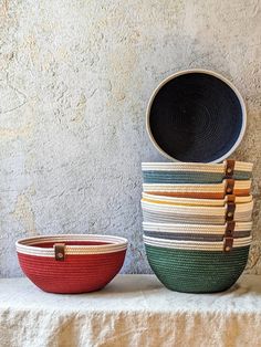 two baskets sitting next to each other on top of a table