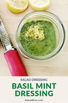 basil mint dressing in a jar with lemons and parmesan cheese on the side