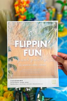 a person holding up a sign that says flippin'fun pool party on it