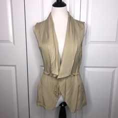 Sold Out At Francesca’s Online. New Francesca’s Trixxi Tan Vest Size Xs. Drawstring Around Back And Ties At Front. Says Olive Color But Actually More Tan. Two Pockets On Front. 100% Tencel! Retails For $48!!! See Pictures For Additional Details. If You Like Any Of My Other Items Let Me Know And We Can Bundle Them Together! Y Beige Vest For Day Out In Spring, Fitted Cotton Vest For Day Out, Fitted Sleeveless Casual Outerwear, Casual Fitted Sleeveless Outerwear, Chic Fitted Summer Outerwear, Summer Cotton Outerwear For Layering, Casual Fitted Spring Vest, Fitted Casual Summer Outerwear, Fitted Vest For Day Out In Fall