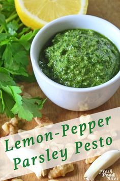 a bowl of lemon pepper parsley pest on a cutting board