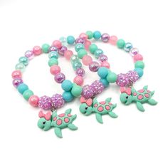 These adorable stretchy bracelets are the perfect favor for your little one's turtle themed party!  Each bracelet features a beautiful acrylic turtle charm and an assortment of pink, lavender, cyan and pale green 10mm acrylic beads strung with durable stretch floss cord. Each bracelet will arrive individually packaged in organza bags.  Select the size and quanity needed from the drop down menus.  Childs xs 2-3yo has an inner circumference of about 5 inches  Childs small 4-5yo has an inner circum Turtle Themed Party, American Girl Birthday Party, Turtle Birthday Parties, Spa Party Favors, Turtle Birthday, Turtle Party, Birthday Bracelet, Cardboard Jewelry Boxes, Turtle Charm