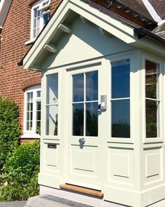 a white house with windows and doors on the outside