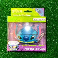 a blue toy with an animal head on it's back in a package sitting on the grass