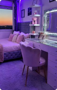 a bedroom with purple lighting and a large mirror on the wall above the bed is lit up by pink lights