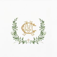 the letter m is surrounded by greenery and leaves on a white paper with gold lettering