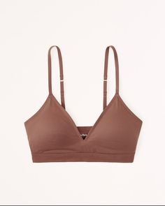 Our new super soft v-neck bralette in our no-show Next to Naked fabric you'll love. Features racerback detail, removable pads, bottom band detail and adjustable straps. Light Support No-show Bra, Everyday Seamless Triangle Top Bra, Everyday Seamless Bra, Everyday Solid Bra With Adjustable Straps, Everyday No-show Seamless Bra, Everyday Seamless No-show Bra, Everyday Fitted Soft Touch Bra, Soft Touch Fitted Everyday Bra, Women's Sleepwear