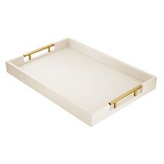 a white tray with gold handles