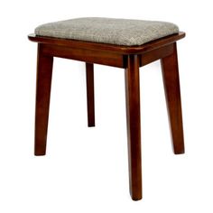 a wooden stool with a seat cushion on it's back and legs, against a white background