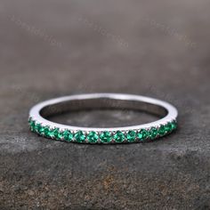 This is a lab Emerald Wedding Ring in 925 sterling silver The stone is 1.5mm. The band is marked S925/G10K/G14K Perfect for Engagement & Wedding,Christmas,Birthday,New Year:) All the jewelry in my store is handmade.It may take 2-3 weeks to finish. I accept custom making order.Please contact me if you need this service. Friendly reminder: For special customized products do not accept return or exchange service, since it was custom made only for you,thank you for your understanding. Sterling Silver Stackable Emerald Wedding Ring, Silver Emerald Half Eternity Ring For Anniversary, Silver Emerald Stackable Ring With Round Band, Silver Emerald Half Eternity Ring, Anniversary Eternity Band With May Birthstone, Silver Half Eternity Birthstone Ring With Round Band, White Gold Emerald Ring With Half Eternity For Promise, Round Emerald Eternity Band As Promise Ring, Anniversary Emerald Eternity Band In Round Shape