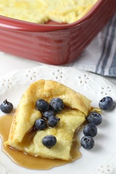 a piece of pie on a plate with blueberries