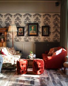 a living room filled with furniture next to a wall mounted radiator and painting