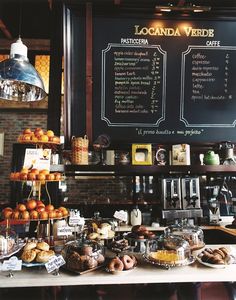 a coffee shop filled with lots of different types of pastries