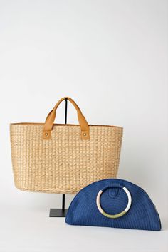 This airy, straw tote bag is finished with natural leather handles and a classic linen lining. Versatile and stylish, it's the perfect partner for airy dresses, summer prints or white denim. Content:- Straw- Leather - Linen Lining- Imported Size:- Width: 18.25" - Height: 12"- Depth: 6.59"- Handle Drop: 4.5" Luxury Chic Straw Bag With Rolled Handles, Luxury White Casual Straw Bag, Luxury Summer Bag For Daily Use, Luxury Everyday Use Summer Bags, Luxury Beige Double Handle Straw Bag, Luxury Modern Rectangular Straw Bag, Leather Handles Tote Beach Bag, Luxury Summer Top Handle Straw Bag, Luxury Summer Bag With Bamboo Handle