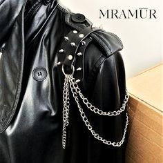 Leather epaulettes with chains and spikes. Accessory in the style of rock metal, which is attached to a coat or jacket. It is fastened by threading a belt from the jacket.  The price includes 2 pieces. Spiked Collar Aesthetic, Leather Shoulder Pads, Metal Shoulder Pads, Spiked Shoulder Pads, Leather Epaulettes, Leather Jacket Spikes, Chain Epaulettes, Leather Pauldron, Shoulder Necklace Gothic