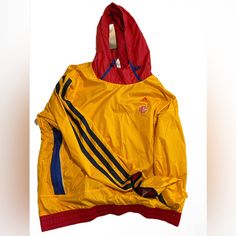 An Insulated Hoodie Co-Created With Eric Emanuel. Yellow, Red And Blue Mcdonald's Hoodie Insulation With Moisture-Wicking Technology To Keep You Warm And Dry Even When You're Working Up A Sweat. Loose Fit Drawcord-Adjustable Hood 100% Recycled Polyester Ripstop Elastic Sleeve Bindings Elastic Hem Mcdonald's Graphics On Chest And Back Fall Streetwear Yellow Hooded Jacket, Yellow Hooded Jacket For Fall Streetwear, Yellow Long Sleeve Hooded Jacket For Streetwear, Yellow Hooded Track Jacket For Winter, Yellow Windbreaker With Adjustable Hood For Winter, Yellow Sporty Track Jacket For Streetwear, Sporty Yellow Hooded Jacket For Streetwear, Adidas Yellow Outerwear For Streetwear, Adidas Yellow Long Sleeve Outerwear