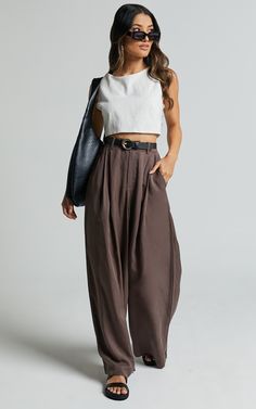 Elevate your everyday style with our Clarke Pants in Slate! These high waist wide leg pants are the epitome of casual sophistication, perfect for any occasion. Crafted from soft Tencel fabric, these relaxed pants offer both comfort and style. The full length design adds a touch of elegance to your look, while the versatile grey shade makes them easy to pair with any top or shoe. Embrace your individuality and feel empowered in these must-have trousers that effortlessly combine fashion and functi Chic Solid Color Relaxed Fit Harem Pants, Chic Wide-leg Harem Pants For Fall, Chic Fall Wide-leg Harem Pants, Baggy Wide Leg Pants For Day Out, Chic Baggy Straight Wide Leg Pants, Chic Baggy Wide Leg Pants, Chic Solid Color Wide Leg Harem Pants, Chic High Waist Harem Pants For Day Out, Chic Workwear Harem Pants