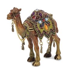 a figurine of a camel with jewelry on it's head and neck