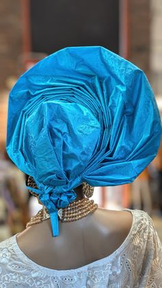 **Product Name: Ireti Crown Blue Autogele Head Wrap by Dupsie's African Fashion** **Product Description:** Elevate your African fashion game with the exquisite **Ireti Crown Blue Autogele Head Wrap**, a stunning pre-tied gele that embodies the rich heritage and vibrant spirit of Nigerian culture. This meticulously crafted head wrap features closely pleated detailing that flares out elegantly, creating a captivating fan-like silhouette that stands approximately 6 inches tall. Perfect for any spec African Head Crown, African Dashiki Shirt, African Tops For Women, African Pants, Nigerian Culture, African Shoes, Yoruba People, African Hats, Dashiki Shirt